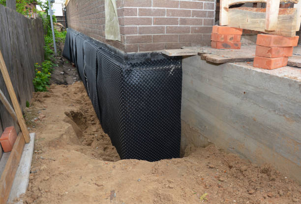 Happy homeowners after waterproofing job in Orange